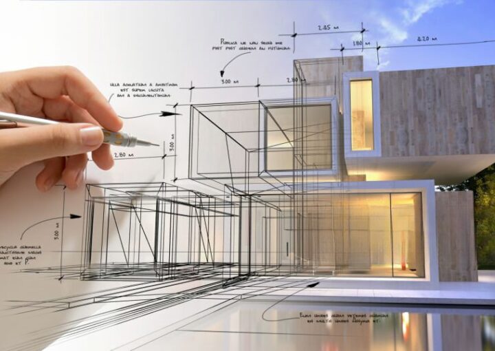 Mão a desenhar um projecto a simbolizar o licenciamento urbanístico